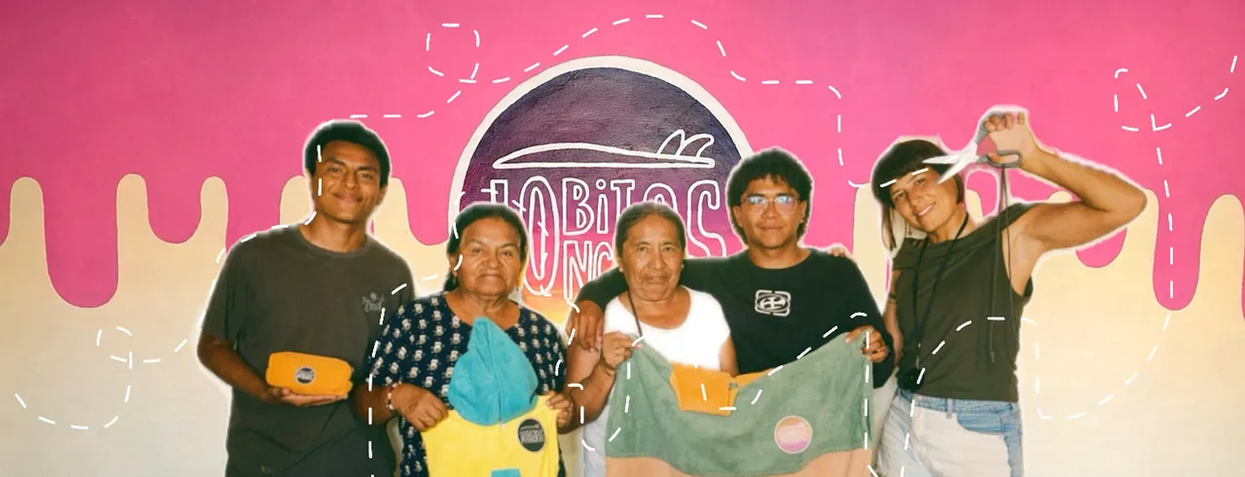 The Lobitos Ponchos team in front of a pink mural, showing off ponchos and pouches